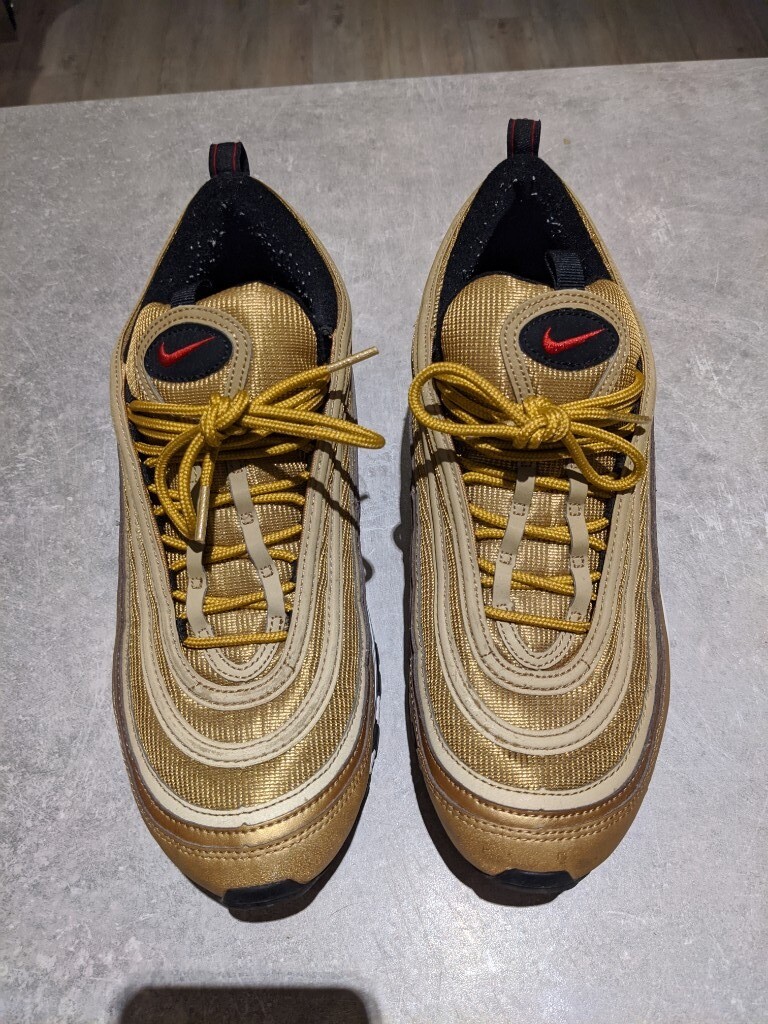 gold nike trainers